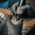 Dad removes full-body tattoos