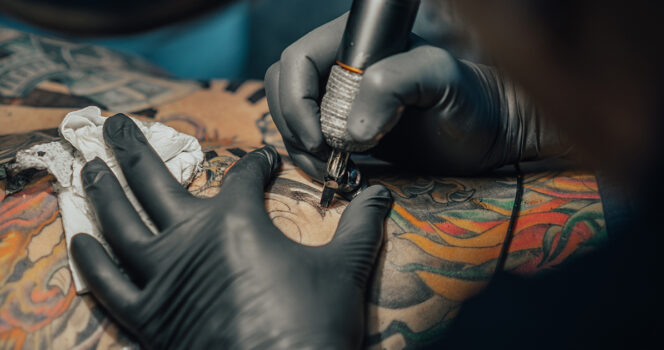 Dad removes full-body tattoos